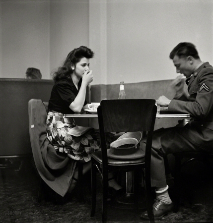 Photo showing: Corporal Nourishment -- May 1942. A corporal in the Army takes his girl to dinner. Bakersfield, California.