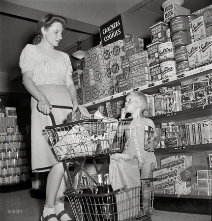 Photo showing: Cheese Midgets -- May 1942. Greenbelt, Maryland. Federal housing project. Shopping in the cooperative grocery store.