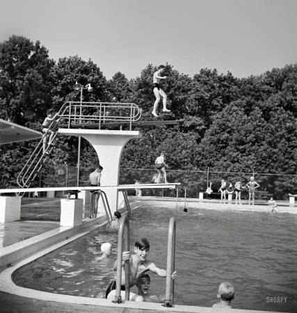 Photo showing: The Greenbelt Pool -- June 1942. Greenbelt, Maryland. Swimming pool. Bathers pay admittance according to age.