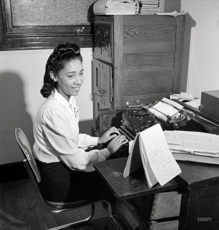 Photo showing: Private Secretary -- New York, 1942. A typist at work.