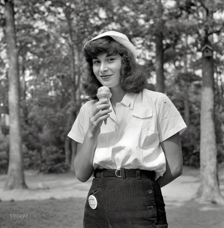 Photo showing: Soft Licker -- August 1942. Interlochen, Michigan. National music camp where 300 or more young musicians
study symphonic music for eight weeks each summer. A student eating an ice cream cone. 