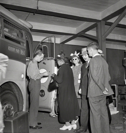 Photo showing: Traveling Incognito -- September 1942. New York, New York. Boarding interstate buses at the Greyhound terminal, 34th Street.