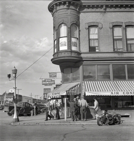 Photo showing: Skeets Cafe -- August 1942. Dillon, Montana. Street corner. Dillon is the trading center for a prosperous cattle and sheep country.