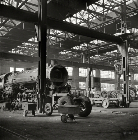 Photo showing: Locomotive Makeover -- November 1942. Illinois Central rail yard, Chicago. Locomotives in for repair at the roundhouse.