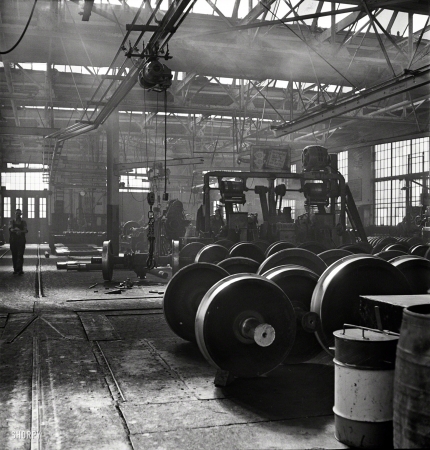 Photo showing: Steel Wheels -- November 1942. Chicago. In the locomotive repair shops at an Illinois Central Railroad yard.