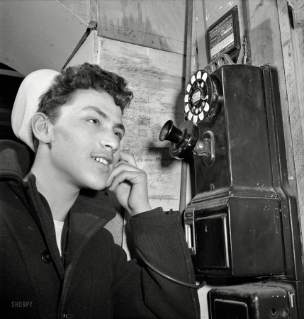 Photo showing: Young Salt -- January 1943. New York. Sixteen-year-old boy who is in the naval reserve on Mulberry Street.