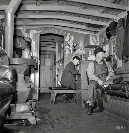 Photo showing: Man-Cave Caboose -- January 1943. Freight train operations on the Chicago & North Western Railroad between Chicago and Clinton, Iowa.