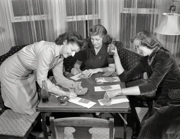 Photo showing: A Game of Cards -- Detroit. Summer 1941. Girls playing cards and drinking Coca-Cola.