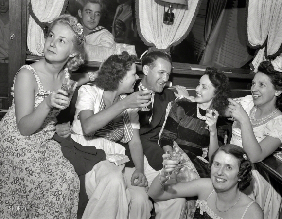 Photo showing: A Toast -- Summer 1940. 'Venetian Night' party at the Detroit Yacht Club, whose members represent the wealthier class of manufacturers.