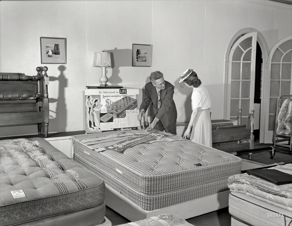 Photo showing: Slumberon Mattress -- July 1941. Detroit, Michigan. Selling mattresses at the Crowley-Milner department store.