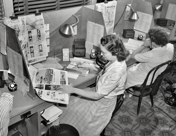 Photo showing: Order Online -- July 1941. Operator taking telephone orders at the Crowley-Milner department store, Detroit.