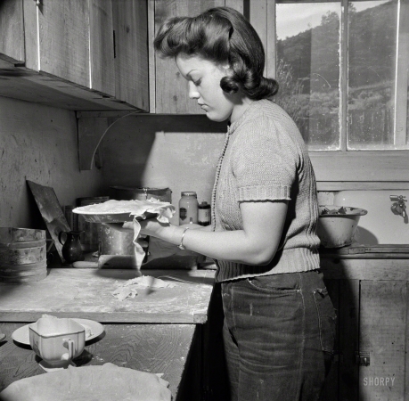 Photo showing: Sugar and Spice -- February 1943. Moreno Valley, New Mexico. Mary Mutz making an apple pie on the Mutz ranch.