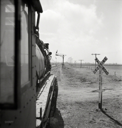 Photo showing: Waiting for the Light -- March 1943. Kiowa (vicinity), Kansas. Train waiting for a block signal along the Atchison, Topeka & Santa Fe.