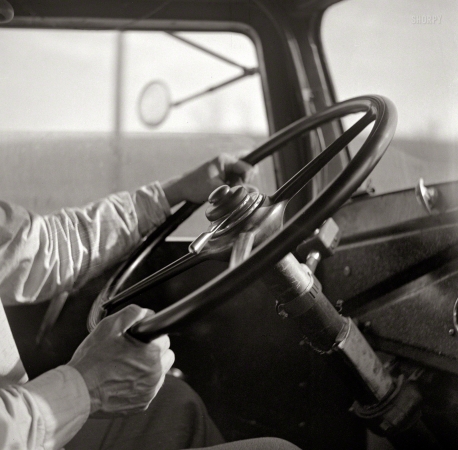 Photo showing: Power Steering -- March 1943. A truck driver on U.S. Highway 29 near Charlottesville, Virginia.