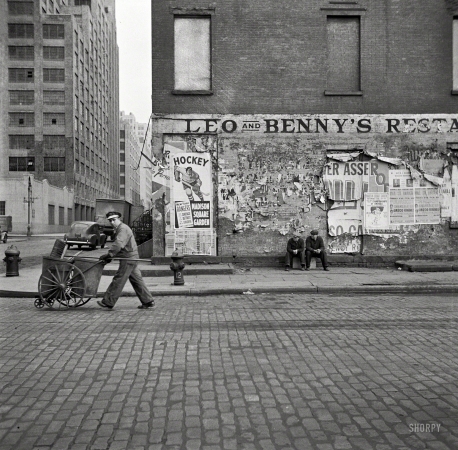 Photo showing: Dept. of Sanitation -- March 1943. New York. A street cleaner on Washington Street.
