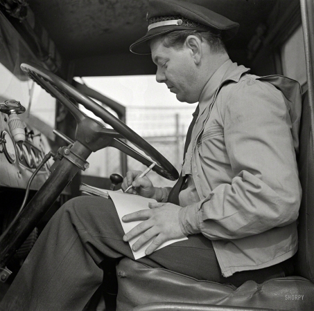 Photo showing: Bobs Log -- March 1943. Washington, D.C. Bob Daugherty filling out his log book after lunch.