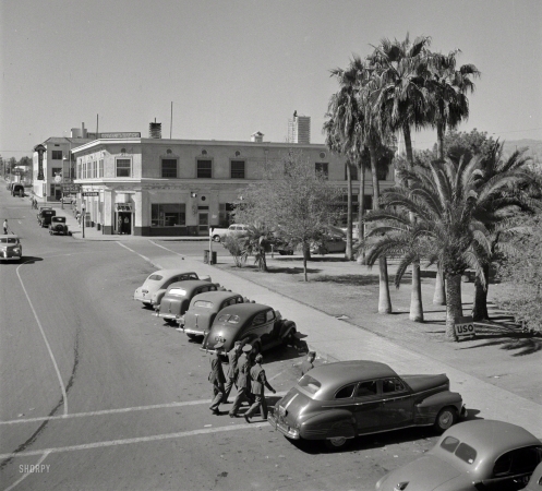 Photo showing: Needles Eye -- March 1943. Needles, California. General view of street leading to Santa Fe R.R. depot. 