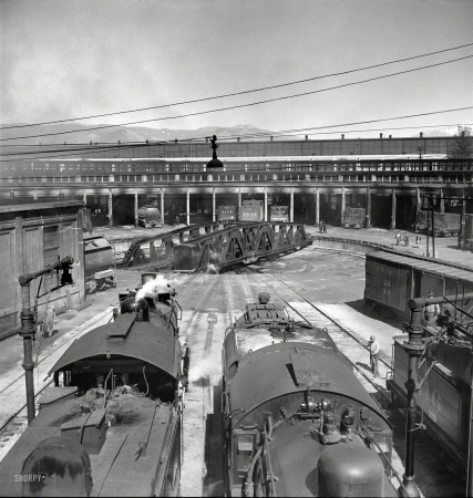 Photo showing: Round Trip -- March 1943. San Bernardino, Calif. Engines at the roundhouse.