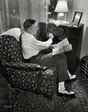 Photo showing: Radio War News -- September 1942. Rochester, New York. Mr. Babcock tuning in for war news.