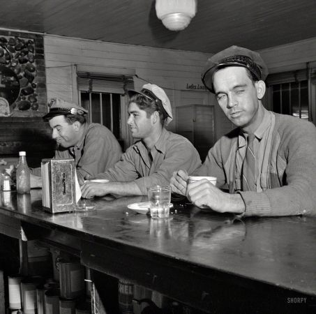 Photo showing: Truck Stop Diners -- March 1943. Pearlington, Mississippi (vicinity). Truck drivers at a highway coffee stop on U.S. Highway 90.