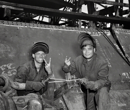 Photo showing: To Victory -- May 1943. Baltimore, Maryland. Welders working on the Liberty ship Frederick Douglass at the Bethlehem-Fairfield shipyards. 