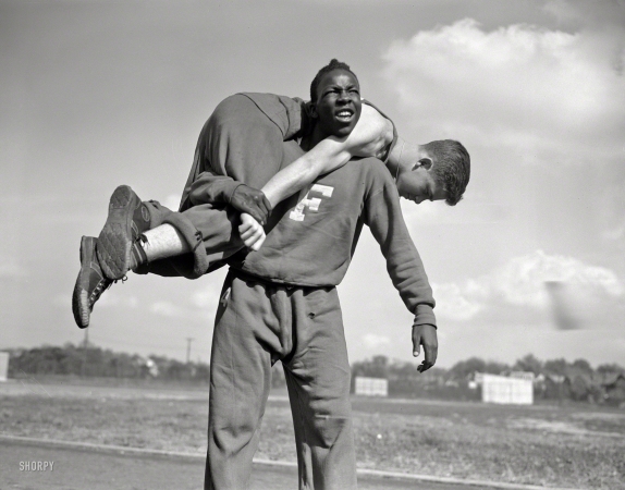 Photo showing: Flushing Commandos -- October 1942. High school Victory Corps. The 'fireman's carry.' Boys in
the 'commando' course at Flushing High School, Queens, New York.