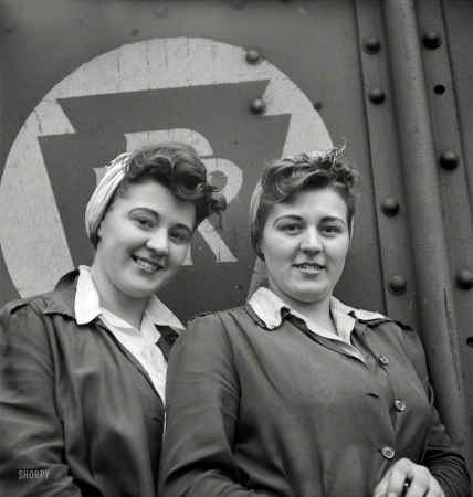 Photo showing: Sister Act -- May 1943. Pitcairn, Pennsylvania. Twins Amy and Mary Rose Lindich, 21,
employed at the Pennsylvania Railroad as car repairmen helpers.