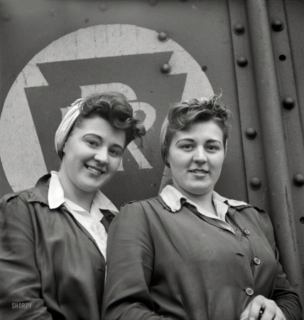 Photo showing: Sister Act -- May 1943. Pitcairn, Pennsylvania. Twins Amy and Mary Rose Lindich, 21,
employed at the Pennsylvania Railroad as car repairmen helpers.