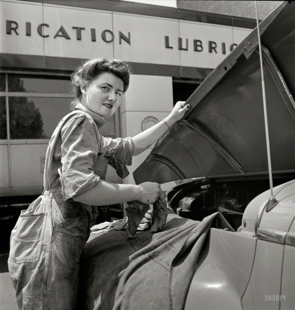 Photo showing: Under the Hood -- June 1943. Philadelphia, Pa. Miss Frances Heisler, a garage attendant at one of the Atlantic Refining Co. garages.