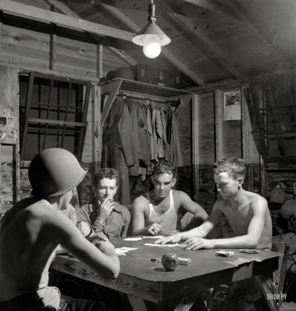 Photo showing: Five Card Studs -- July 1943. Greenville, South Carolina. Air Service Command. Men of the Quartermaster
Truck Company of the 25th Service Group having a card game in one of the barracks.