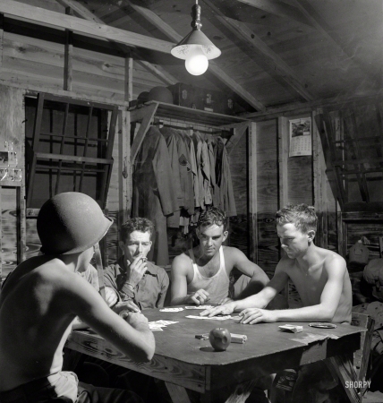 Photo showing: Five Card Studs -- July 1943. Greenville, South Carolina. Air Service Command. Men of the Quartermaster
Truck Company of the 25th Service Group having a card game in one of the barracks.