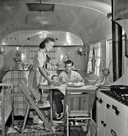Photo showing: Suppertime -- August 1943. Middle River, Maryland. A Farm Security Administration housing project
for Glenn L. Martin aircraft workers. A worker's family in their trailer home. 