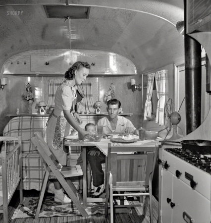 Photo showing: Suppertime -- August 1943. Middle River, Maryland. A Farm Security Administration housing project
for Glenn L. Martin aircraft workers. A worker's family in their trailer home. 