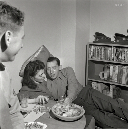 Photo showing: Night Maneuvers -- October 1943. Washington, D.C. Servicemen and girl at a party.