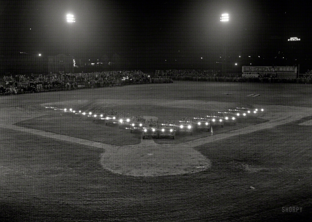 Photo showing: Safe at Home -- Sept. 29, 1942. War production drive. Jeep headlights form V for Victory
at night rally for Pennsylvania anthracite miners in Wilkes-Barre.