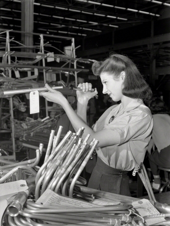 Photo showing: Tube Inspector -- July 1942. Parts inspection. Ford bomber plant at Willow Run, Michigan.