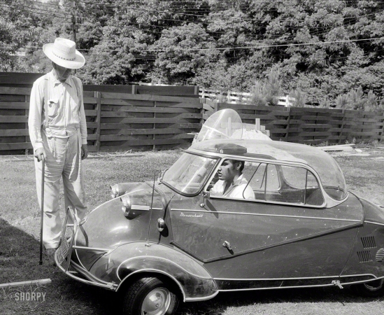 Photo showing: Elvis and His Messerschmitt -- Elvis Presley in 1956 at home in Memphis with his Messerschmitt bubble car and grandfather Jessie Presley.