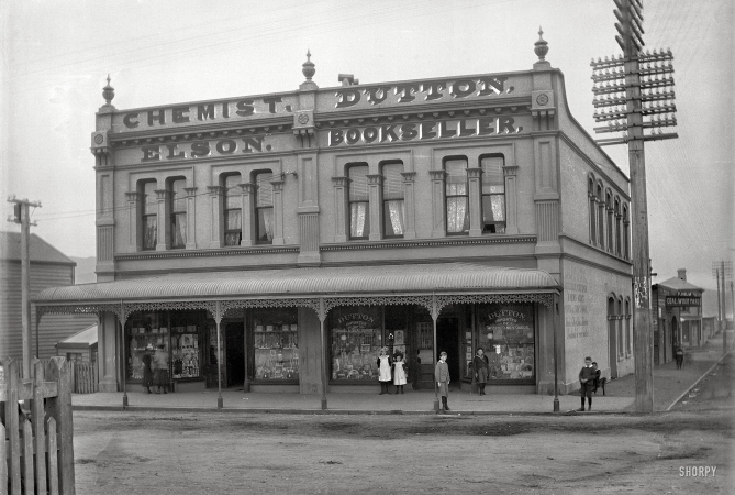 Photo showing: Toys and Fancy Goods  -- Elson chemist and Dutton bookshop on Courtenay Place, Wellington, between 1896 and 1897.