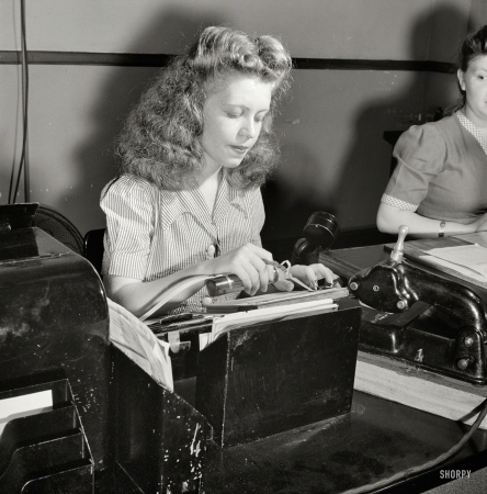 Photo showing: Telegram Gummer -- June 1943. Washington, D.C. Miss Kathleen McCarthy, a Western Union teleprinter operator, gumming telegraph messages.