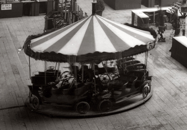 Photo showing: Car Merry-Go-Round -- Merry-go-round display at Madison Square Garden toy show, 1908.