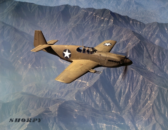 Photo showing: P51 Mustang -- October 1942. P-51 Mustang fighter in flight near the Inglewood, California, plant of North American Aviation.